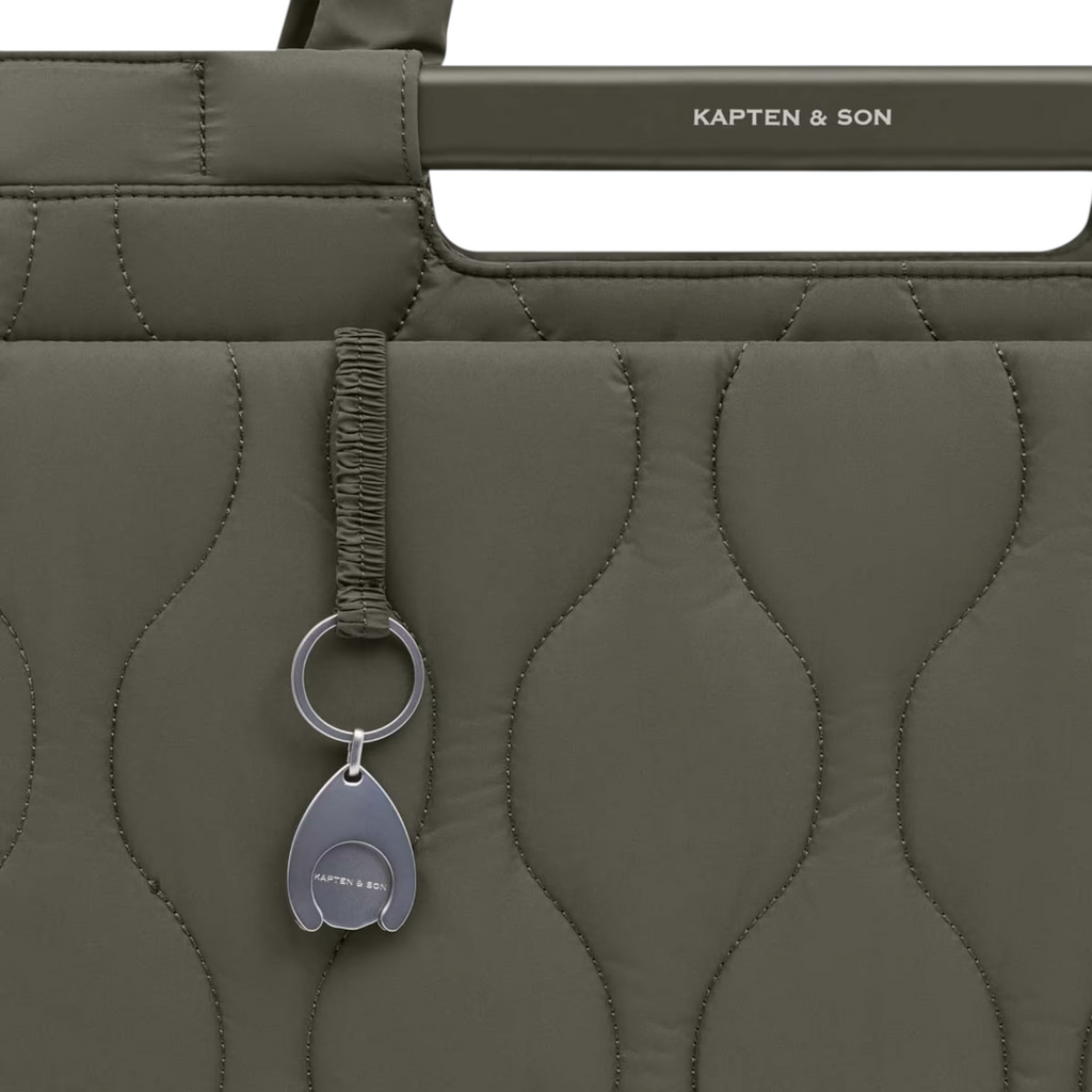 Lieblingstasche Vaasa quilted shopping basket in olive green with metallic logo charm and structured handle