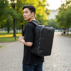 Lieblingstasche Venture Line Duffle M black travel backpack with adjustable straps and Travelite logo.